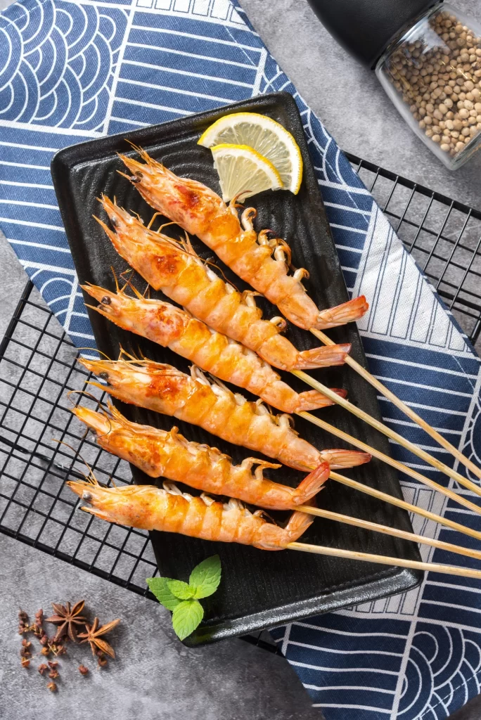 Grilled Shrimp Skewers Lemon Garnish Blue Plate
