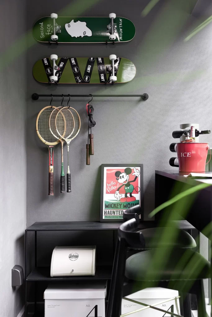 Industrial Chic Sports Room Black White Green Skateboards Badminton Rackets