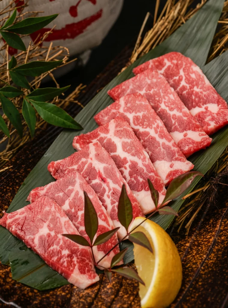 Kobe Beef Ribeye Marbled Red Fat Green Leaf Dark Plate