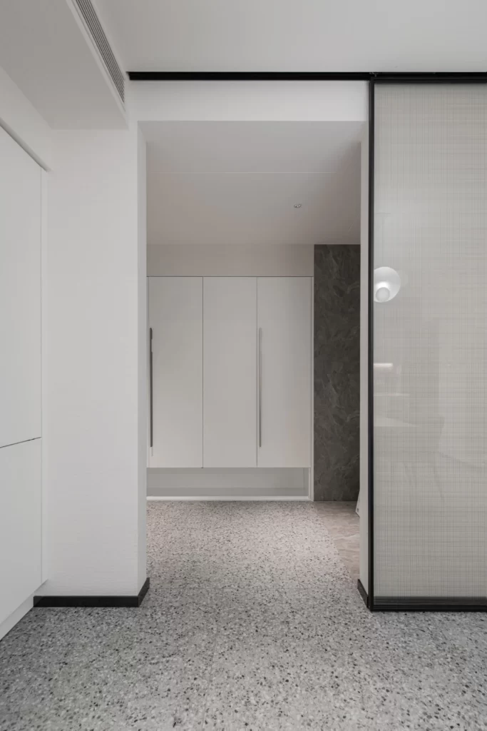 Minimalist Closet White Neutral Terrazzo Floor Glass Door