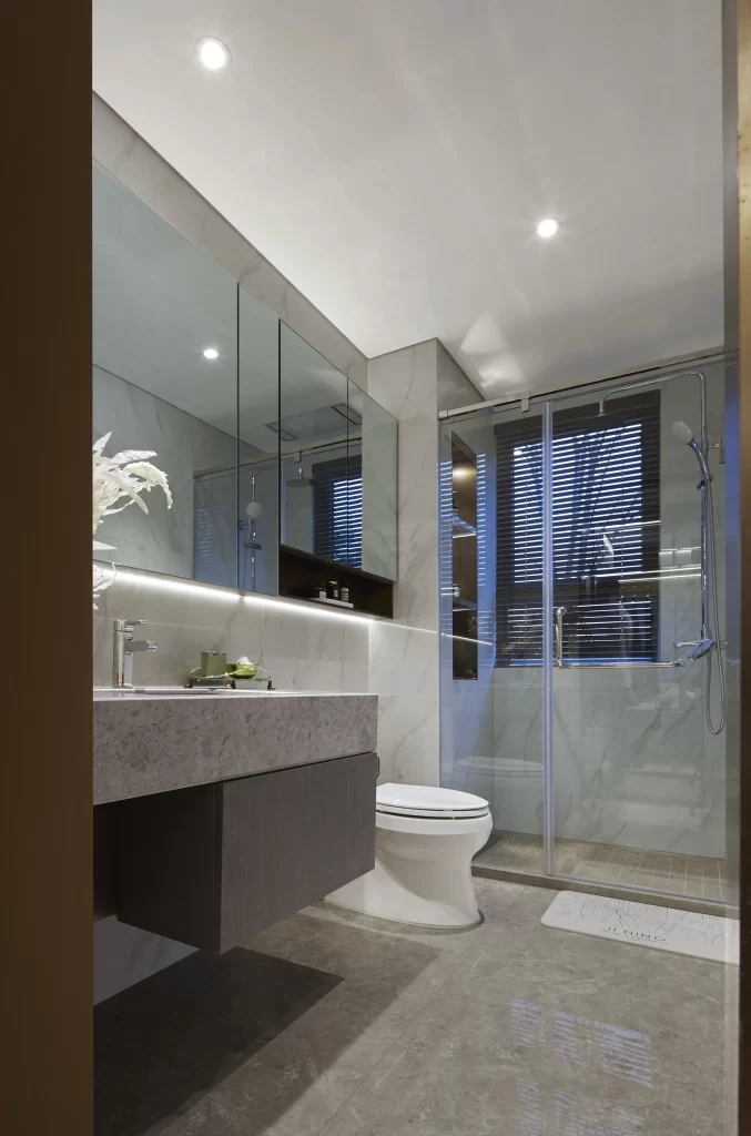 Modern Bathroom Neutral Tones Glass Shower Marble Accents
