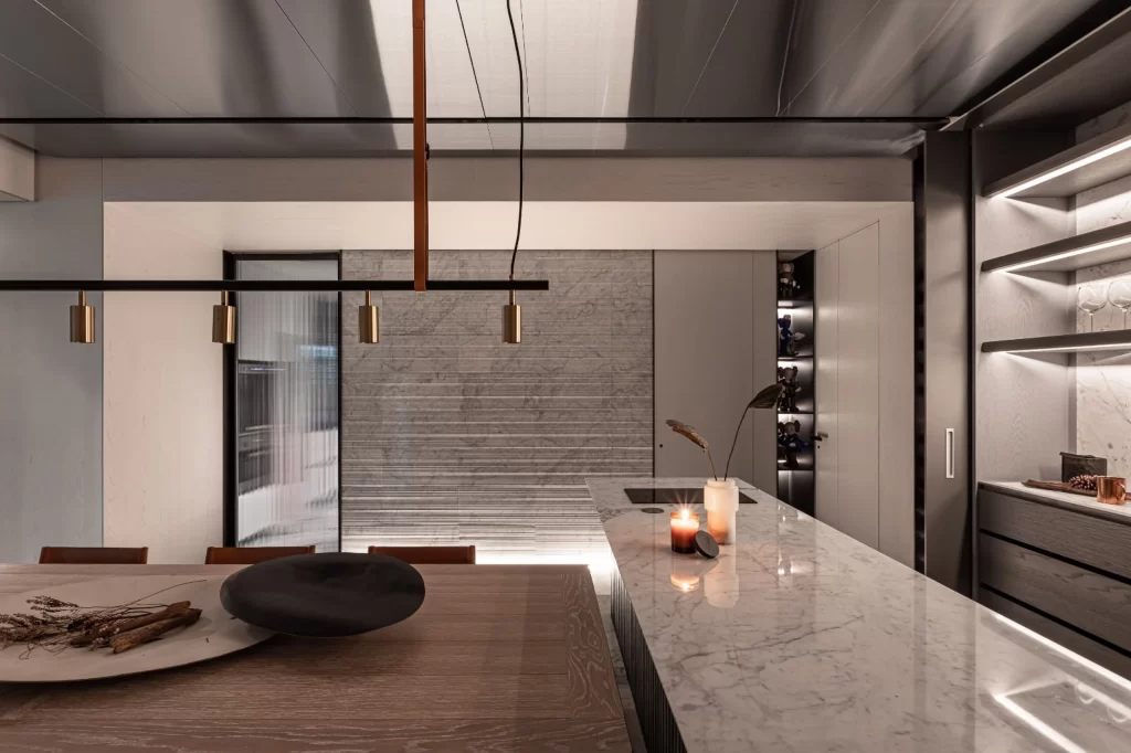 Modern Kitchen Neutral Tones Marble Countertop Wooden Table Minimalist
