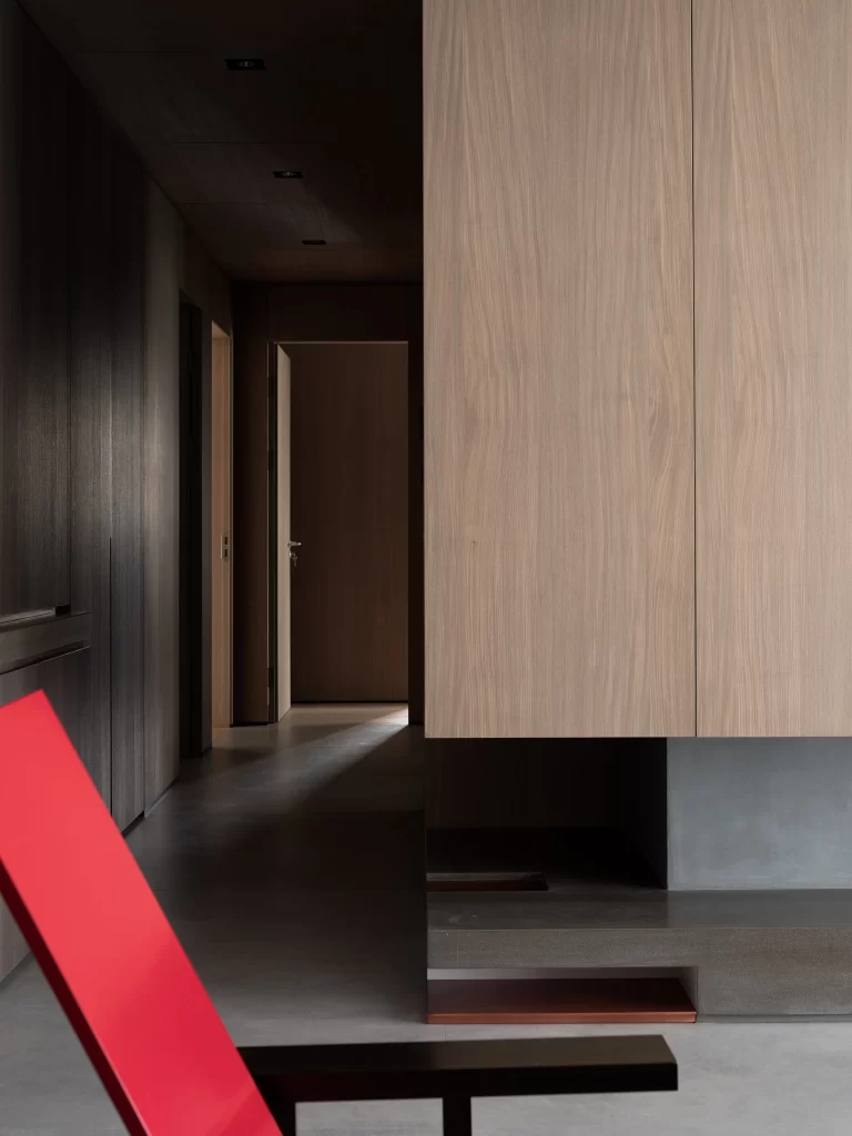 Modern Minimalist Hallway Neutral Dark Wood Red Accents