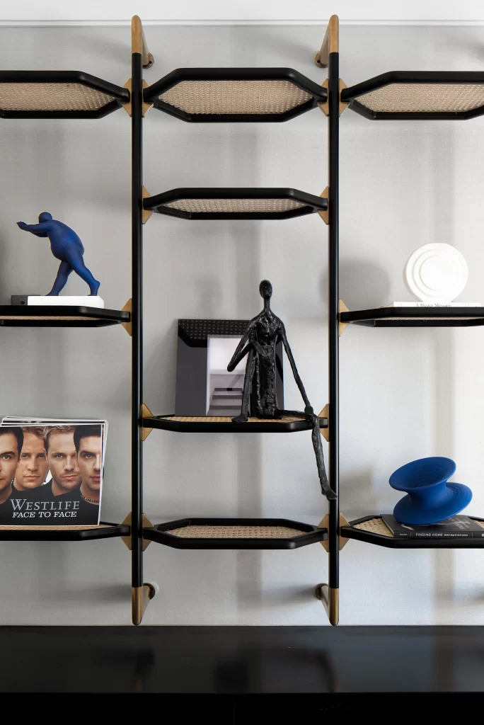 Modern Shelving Unit Black And Gold Accents Neutral Color Palette Sculptures Decorative Objects
