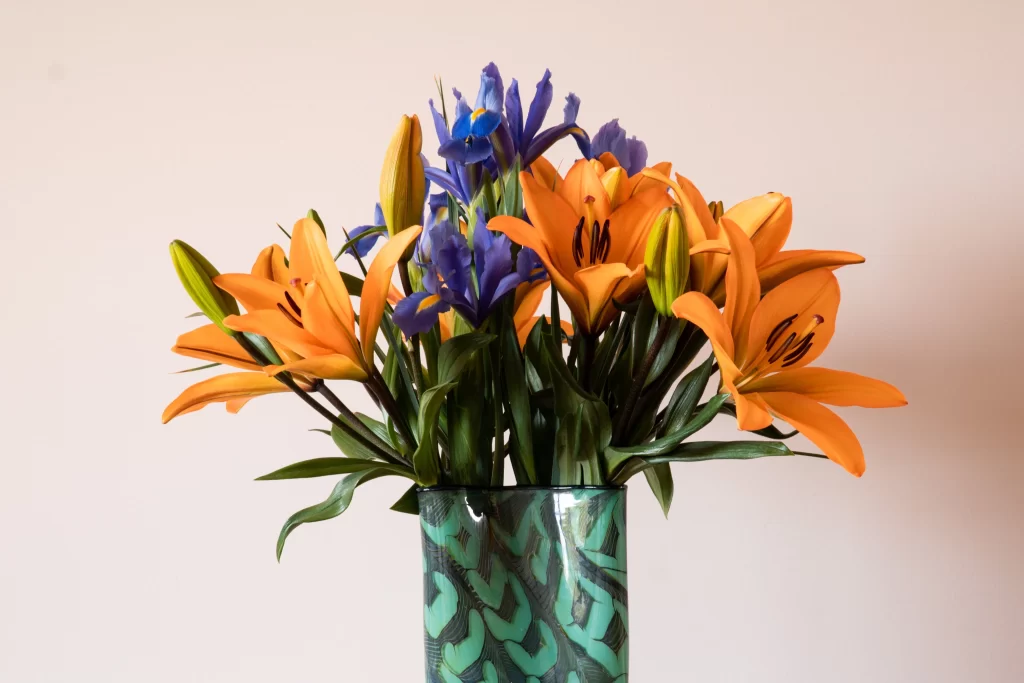 Orange Lily Trumpet-shaped Blooms Blue Iris Vase