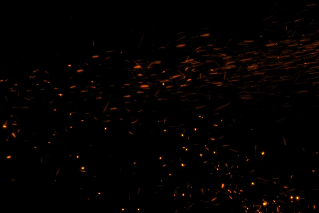 Orange Yellow Sparks Flying Dynamic Intense Dark