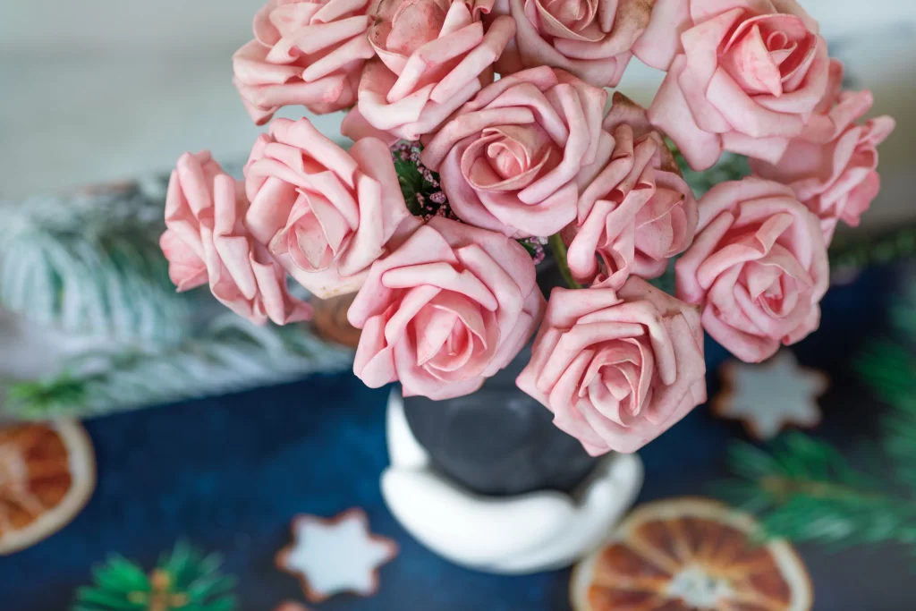 Pink Rose Petals Green Leaves Blue Tablecloth