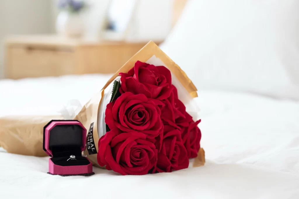 Red Rose Petals Brown Paper White Bed