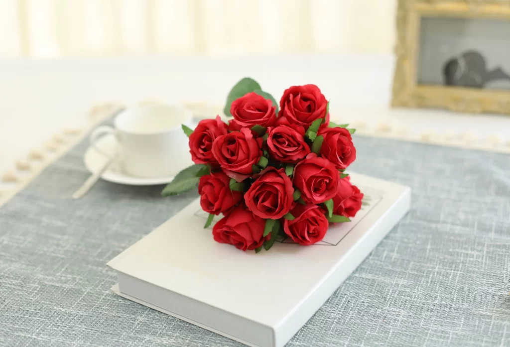 Red Rose Petals Green Leaves White Book Blue Tablecloth