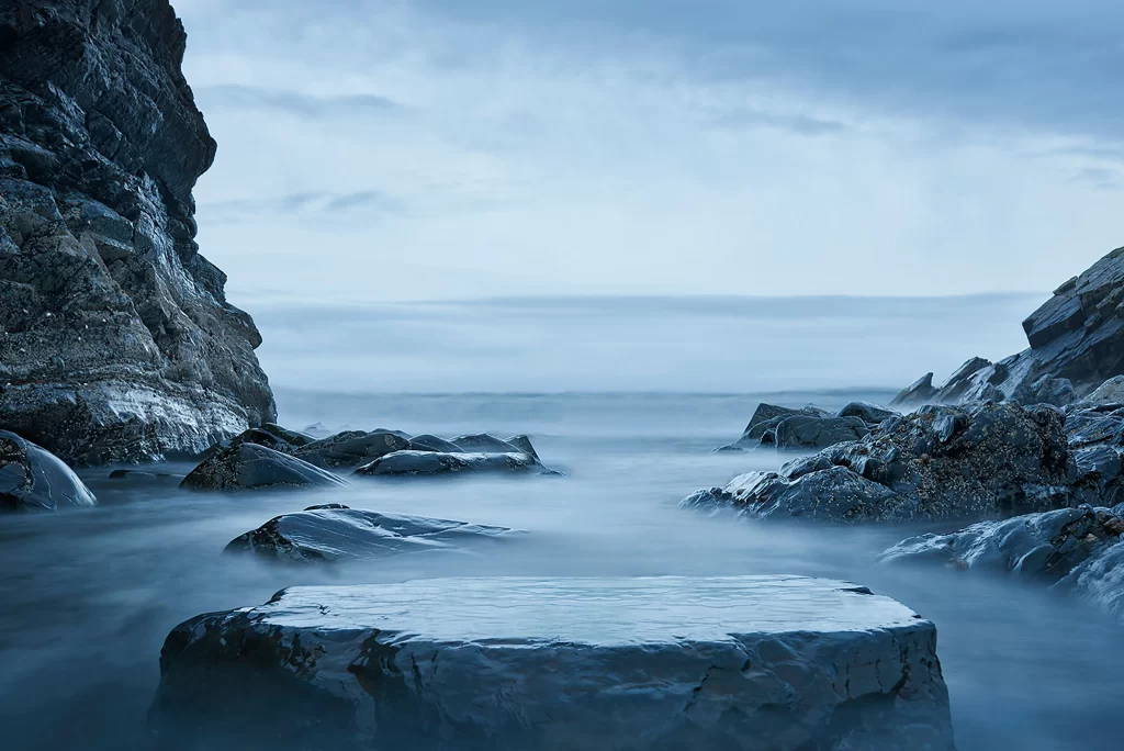 Rocky Shoreline Ocean Mist Blue Sky