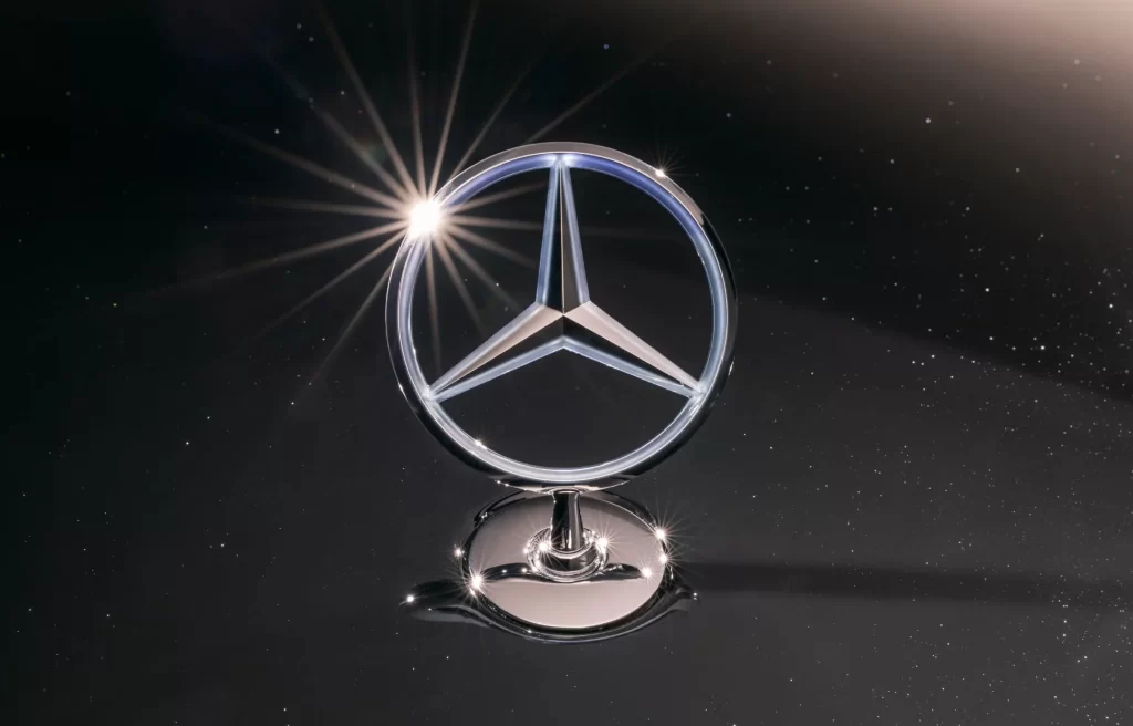 Shiny Mercedes-Benz Emblem with Light Flare