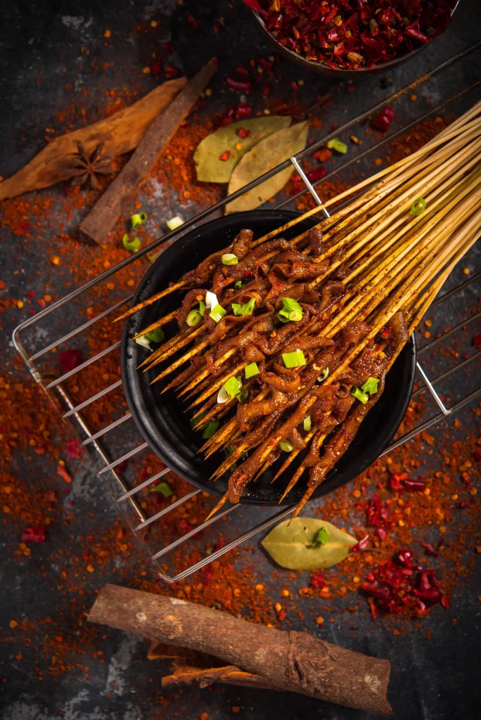 Spicy Beef Skewers Charred Crust Green Onion Garnish