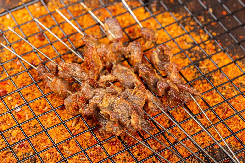 Spicy Beef Skewers Charred Crust Grilled Close Up