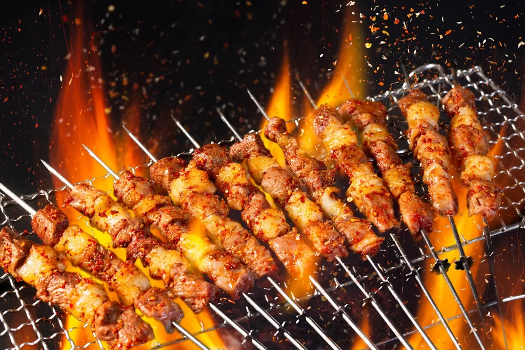 Spicy Beef Skewers Charred Red Chili Flakes Open Flame