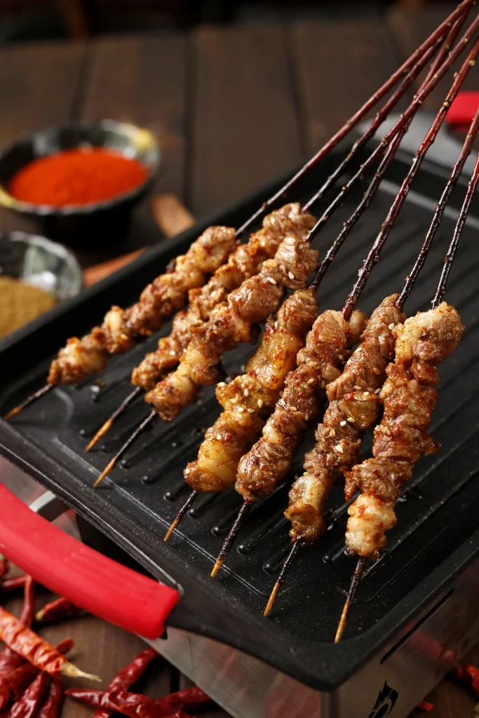 Spicy Beef Skewers Charred Red Chili Garnish