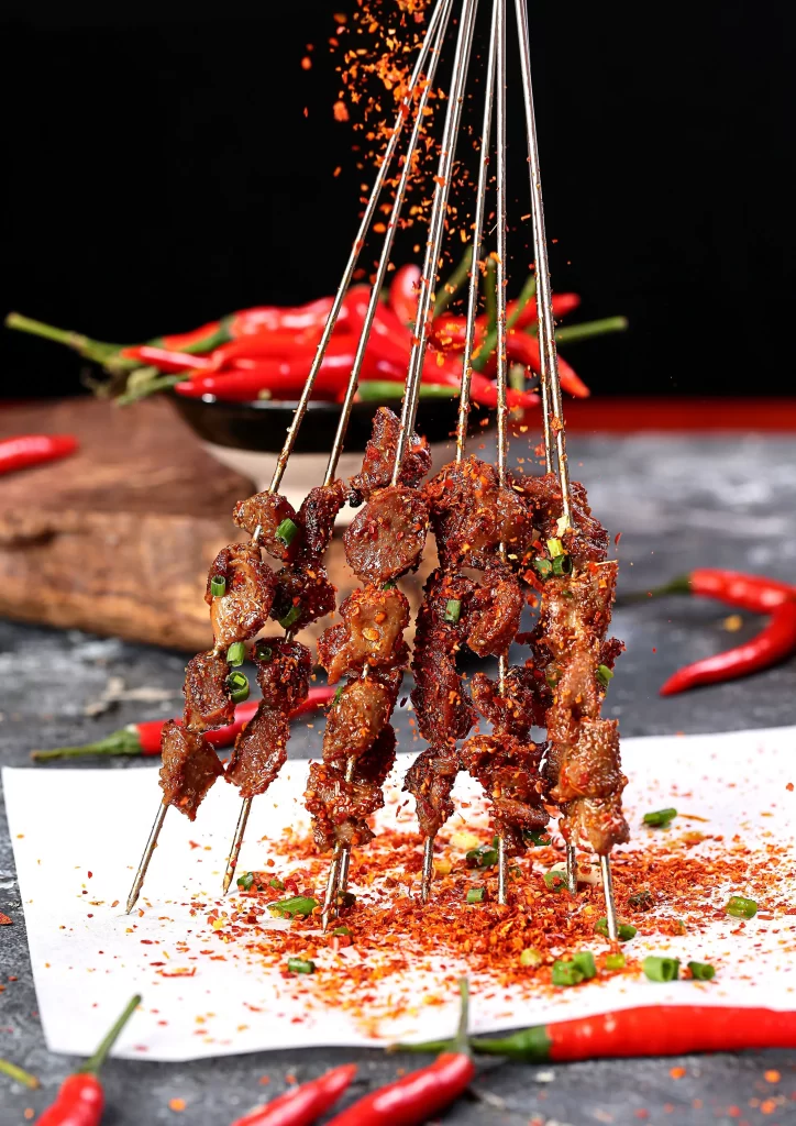 Spicy Beef Skewers Red Chili Powder Green Onion Garnish