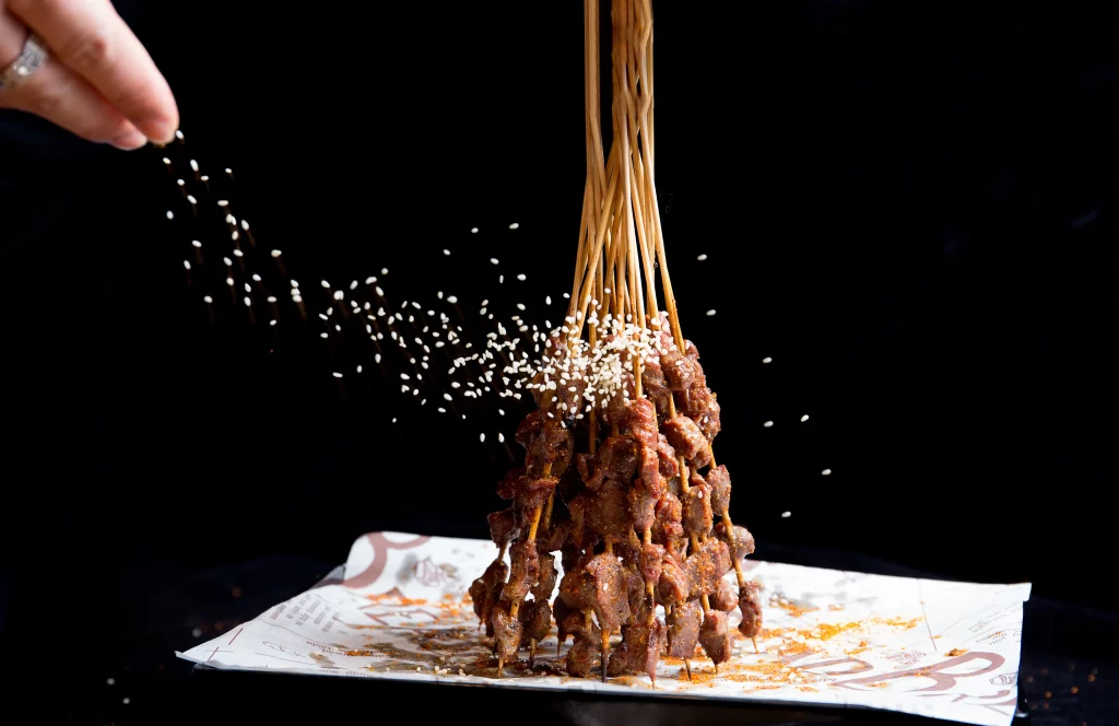 Spicy Beef Skewers with Sesame Garnish