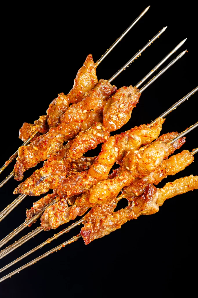 Spicy Chicken Skewers Golden Crust Sesame Garnish