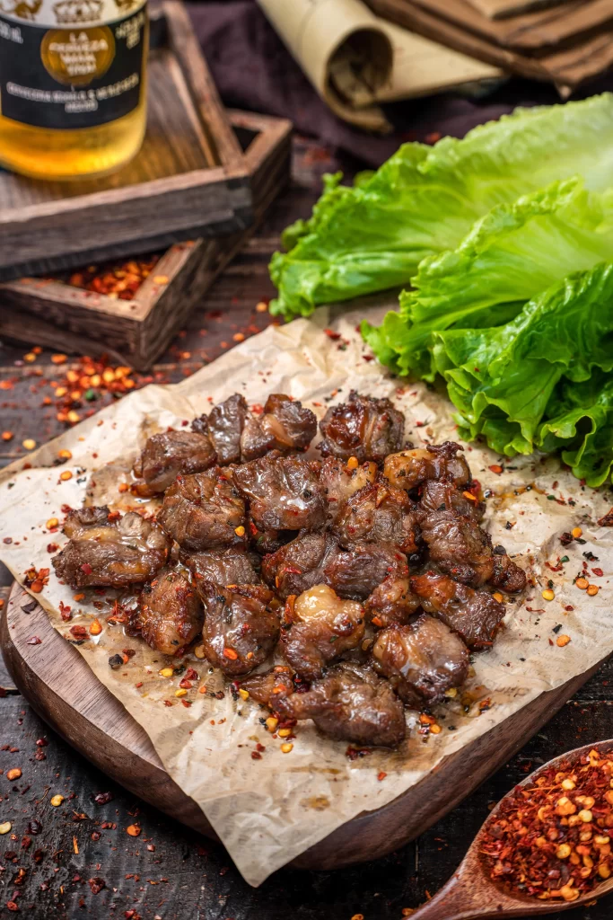 Spicy Grilled Beef Cubes Fresh Lettuce Garnish