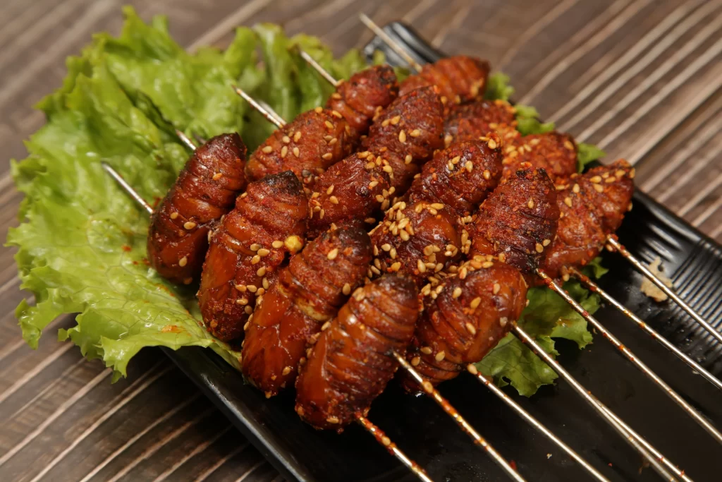 Spicy Grilled Caterpillar Skewers with Sesame Garnish