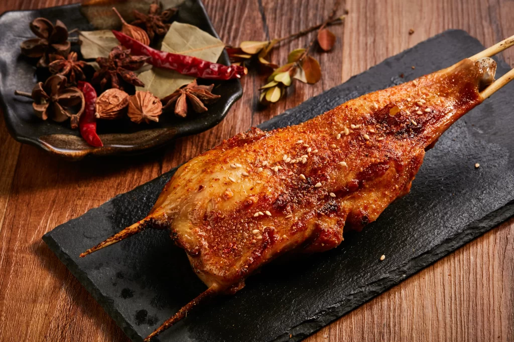 Spicy Grilled Chicken Leg Sesame Garnish Black Slate