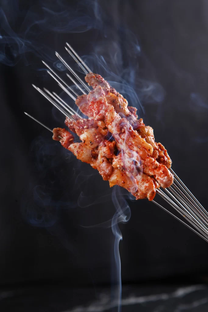 Spicy Grilled Chicken Skewers Charred Reddish-Brown Smoke