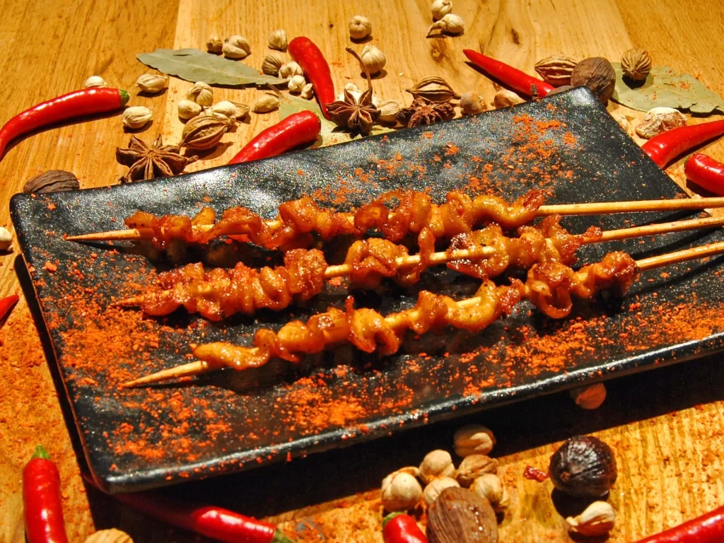 Spicy Grilled Chicken Skewers Red Pepper Dust Black Plate