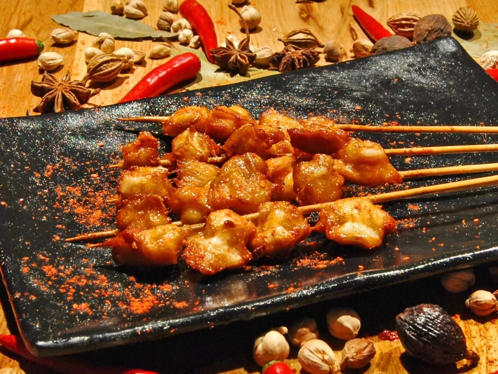 Spicy Grilled Chicken Skewers Red Pepper Flakes Black Plate