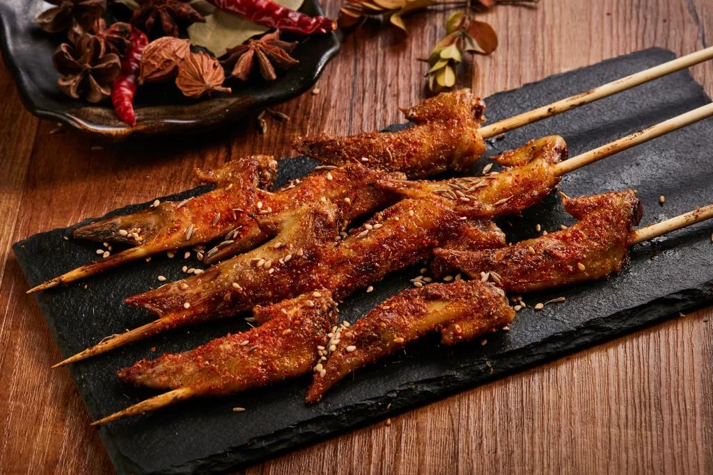 Spicy Grilled Chicken Skewers Sesame Garnish Black Slate
