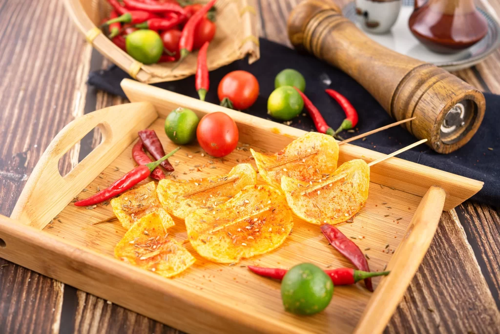 Spicy Grilled Chicken Skewers with Lime and Chili Garnish