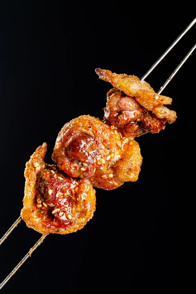 Spicy Grilled Chicken Skewers with Sesame and Chili Sauce