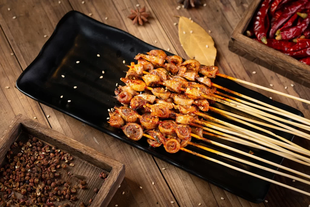 Spicy Grilled Chicken Skewers with Sesame Garnish