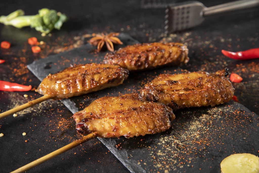 Spicy Grilled Chicken Wings Charred Crust Red Pepper Flakes