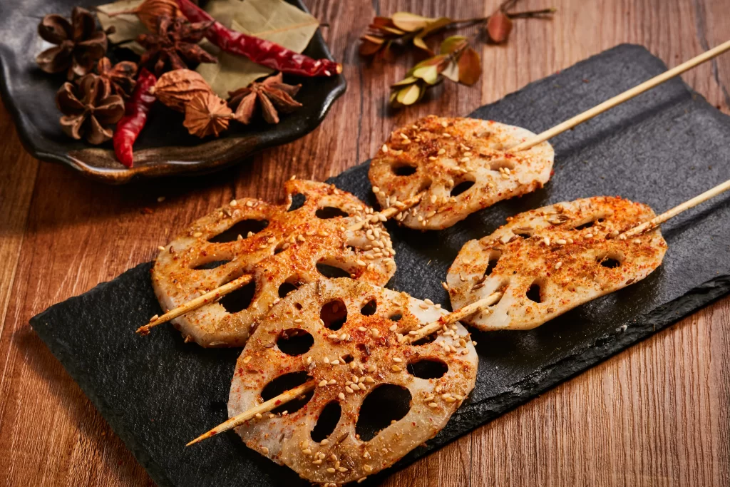 Spicy Grilled Lotus Root Skewers Sesame Seeds Black Slate