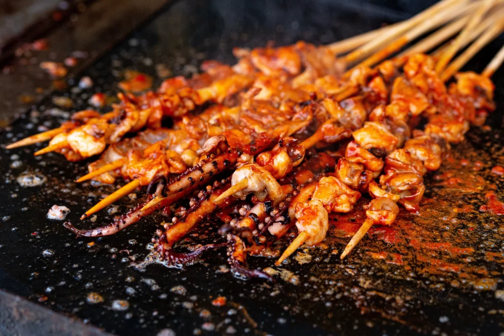 Spicy Grilled Octopus Skewers Charred Tentacles Red Sauce