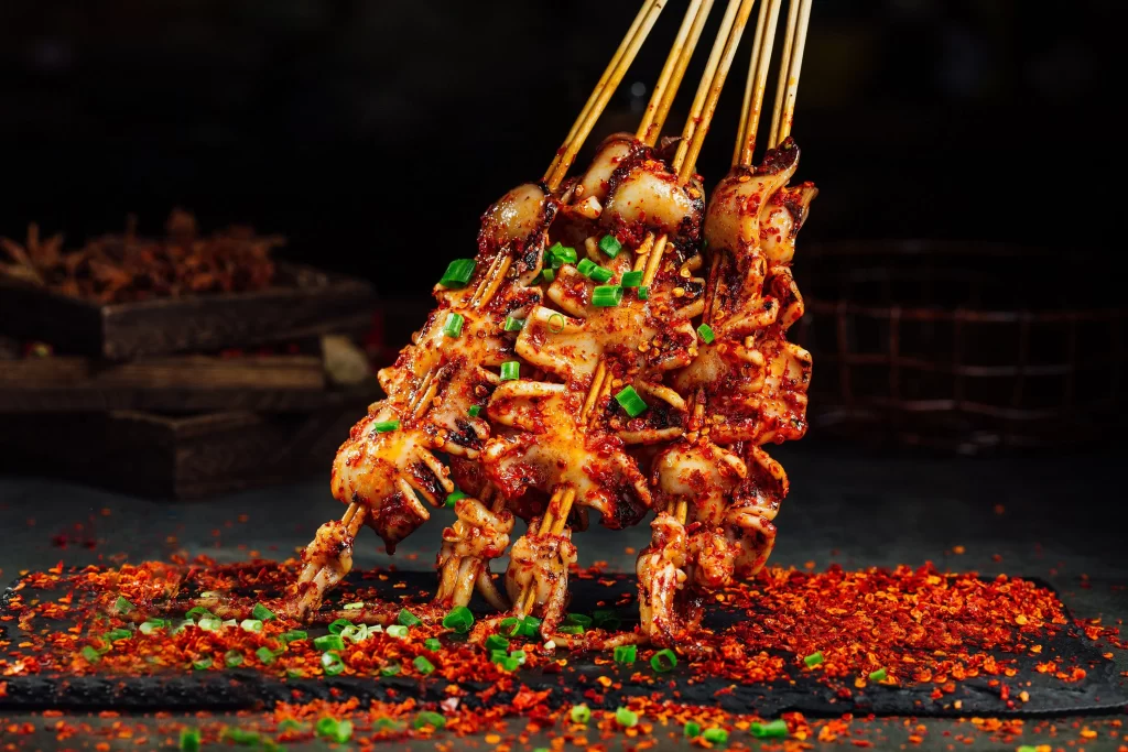 Spicy Grilled Octopus Skewers Red Chili Garnish