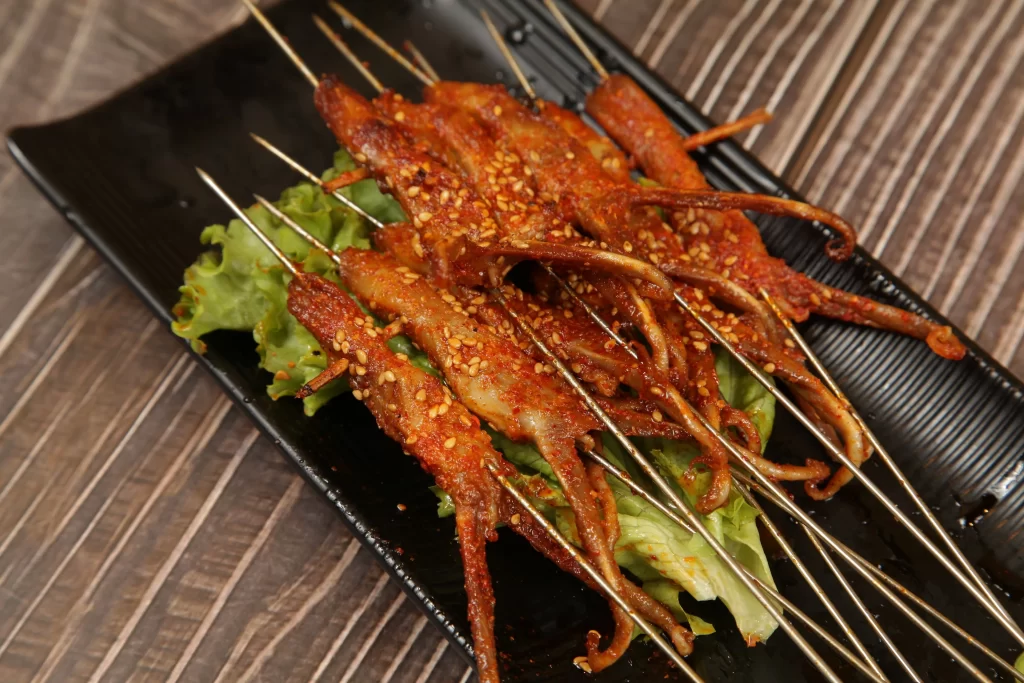 Spicy Grilled Octopus Skewers with Sesame Garnish