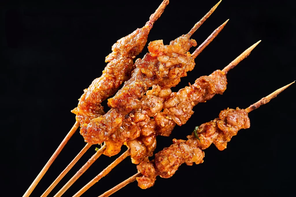 Spicy Grilled Pork Skewers Golden Brown Crispy Close Up