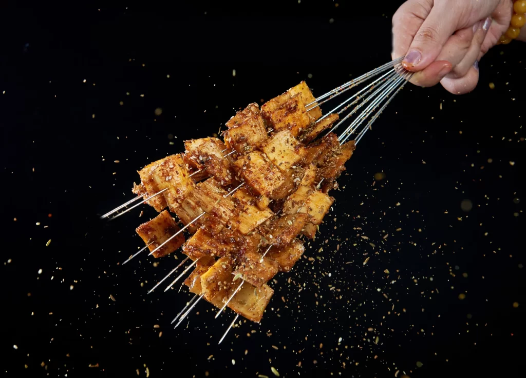 Spicy Grilled Pork Skewers Golden Crust Cumin Garnish