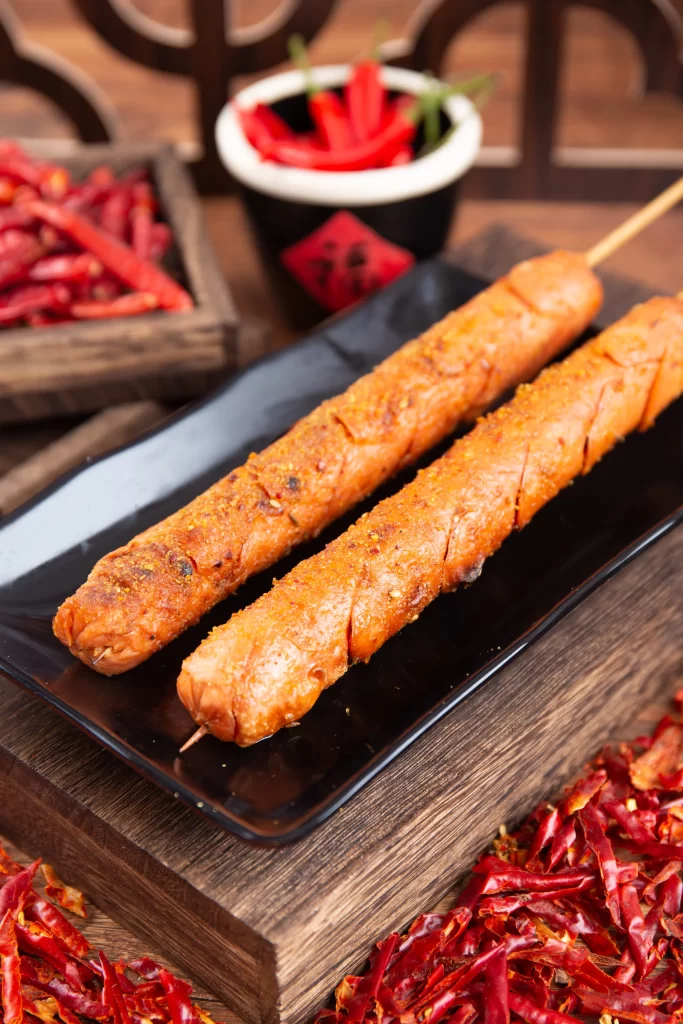 Spicy Grilled Sausage Skewers Golden Crust Red Chili Garnish