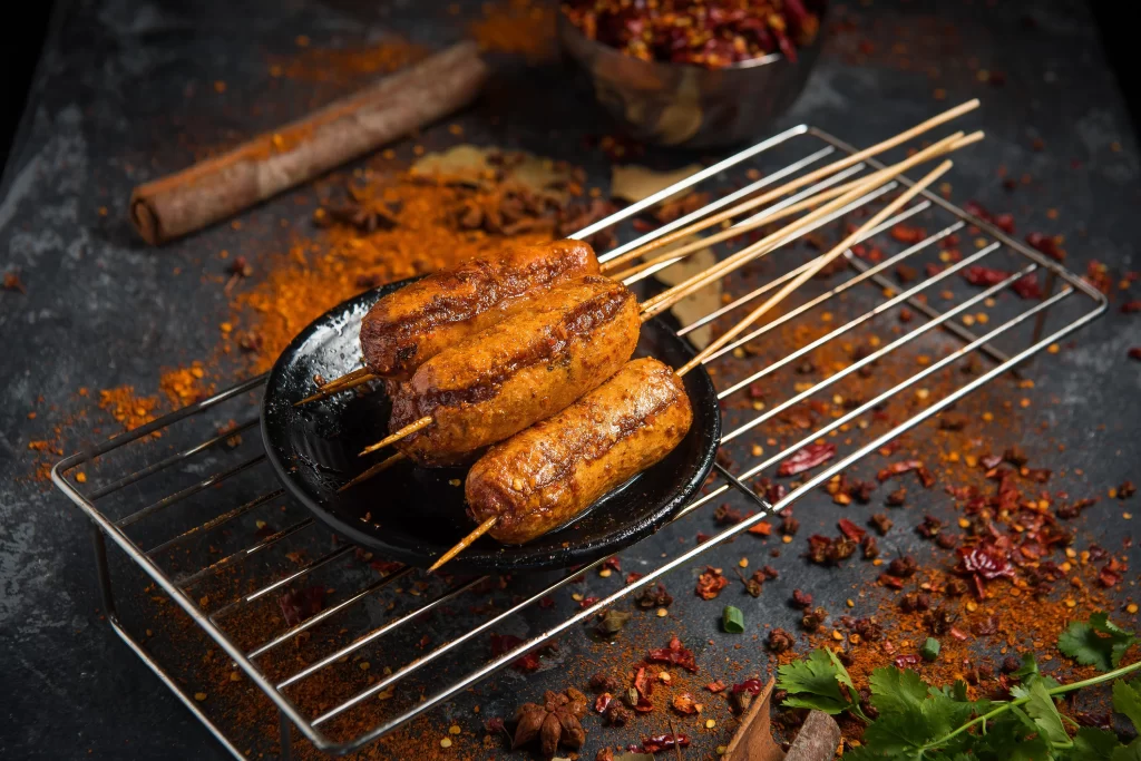 Spicy Grilled Sausages Wooden Skewers Black Plate
