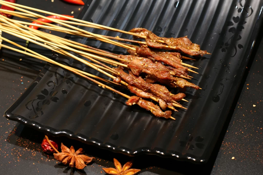Spicy Lamb Skewers Charred Crust Black Plate