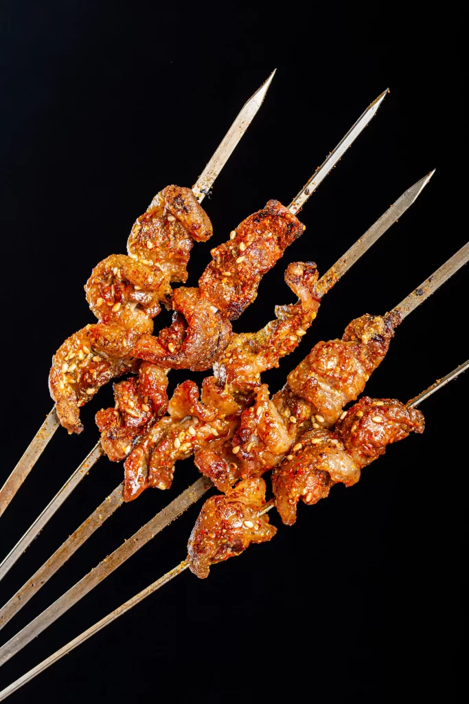 Spicy Lamb Skewers Charred Crust Golden Brown Close Up