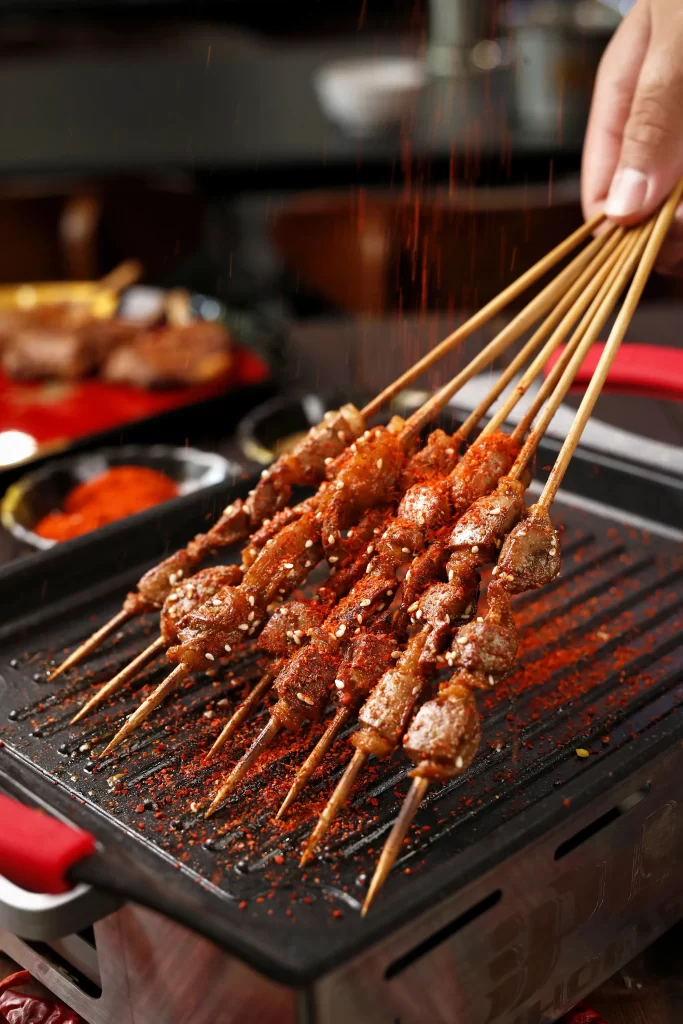 Spicy Lamb Skewers Red Pepper Sesame Garnish