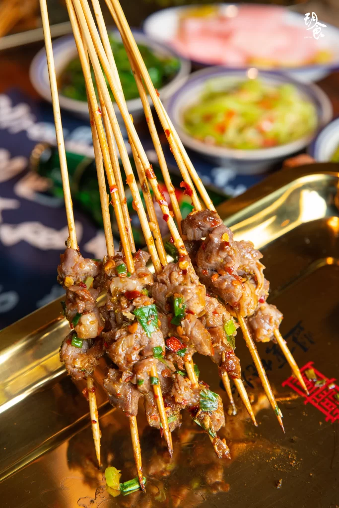 Spicy Lamb Skewers with Green Onion Garnish