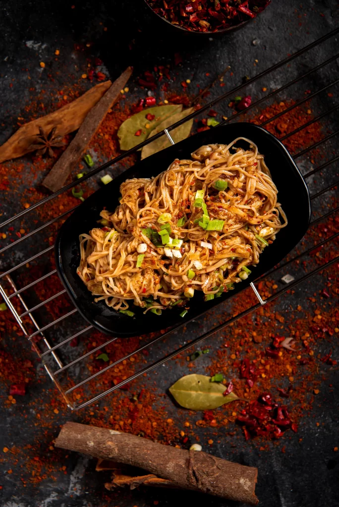 Spicy Noodles Stir-Fry Black Plate Green Onions
