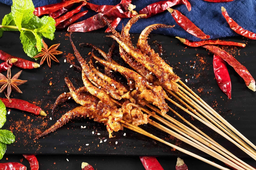 Spicy Octopus Skewers Charred Red Chili Garnish