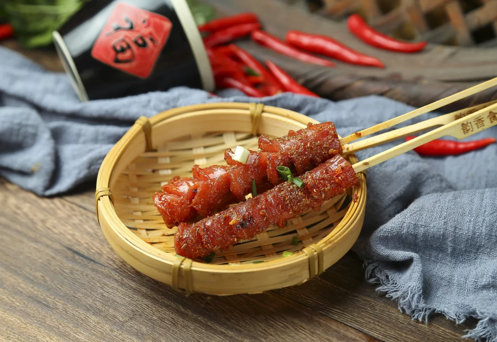 Spicy Pork Skewers Charred Crust Fresh Herbs Garnish