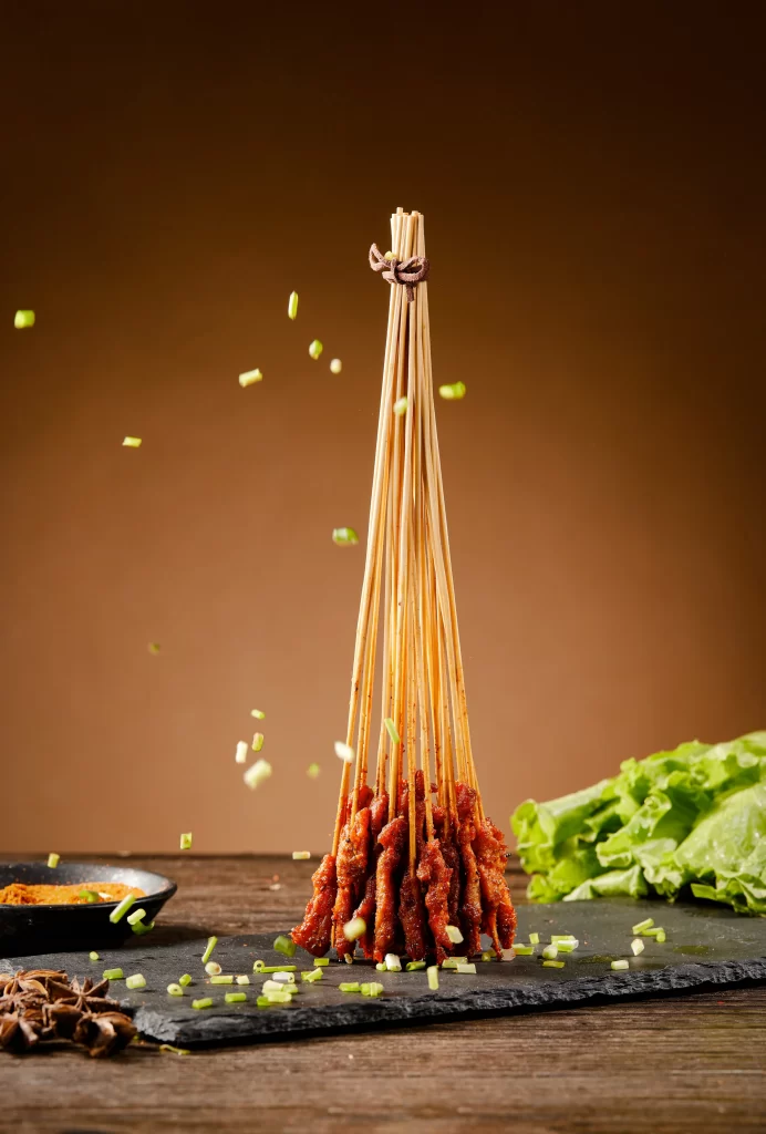 Spicy Pork Skewers Charred Crust Garnished Green Onions