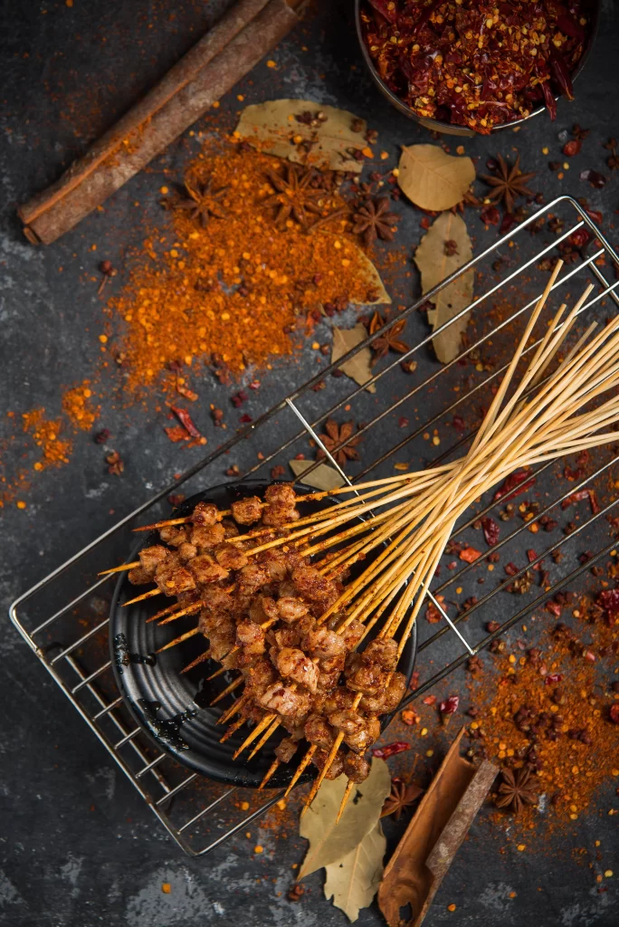 Spicy Pork Skewers Charred Crust Rustic Presentation